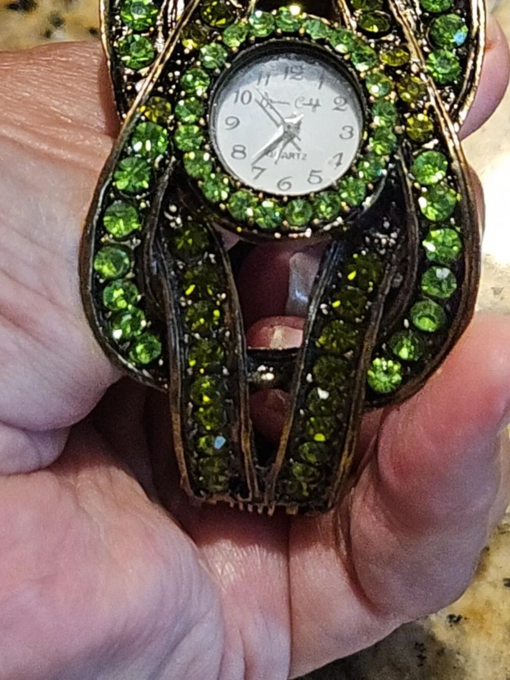 Beautiful hinged, Emerald style watch with new battery. Worned once to Wicked.